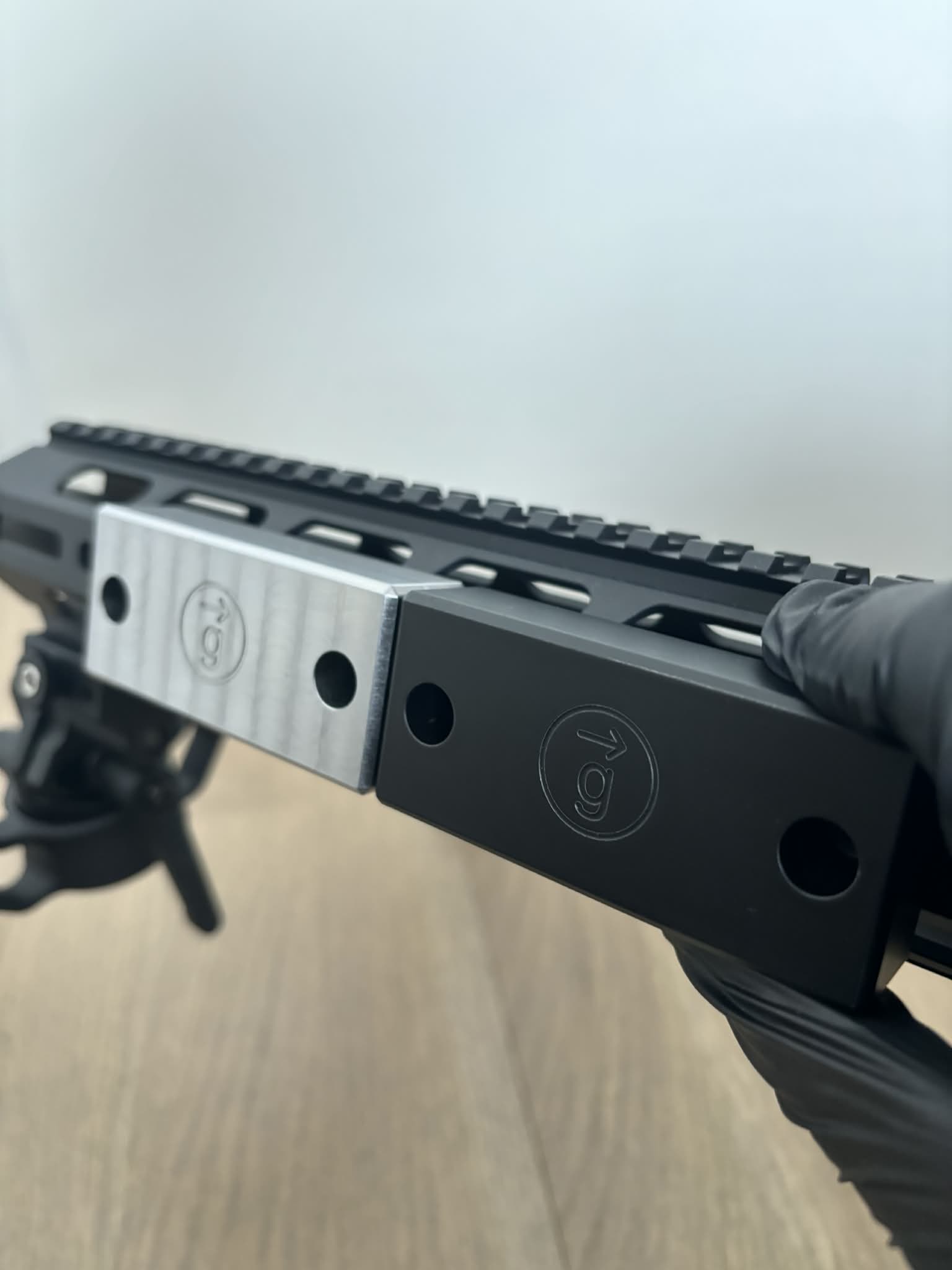 One painted weight mounted next to an untouched one from factory