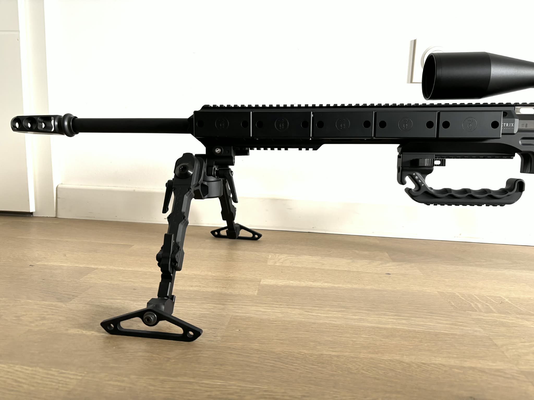 Side view of the rifle with all weights mounted